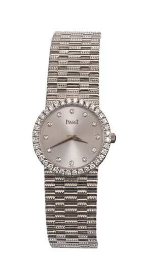 PIAGET 14KT WHITE GOLD AND DIAMOND TRADITIONAL LADY'S WRIST WATCH Serial number 921485-02. Quartz movement. Dial with diamond hour m..