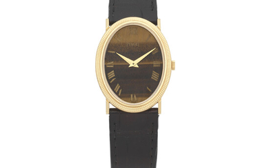 Piaget. An 18K gold manual wind oval form wristwatch with Tiger's Eye dial Circa 1980