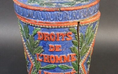 Covered pot in polychrome carved wood with revolutionary decoration and inscription. "Duty of Man. To die for the nation. Rights of Man. Freedom. Equality. RF". Decorated in two cartridges in rhombuses of a Phrygian cap on a pike and the spade of...