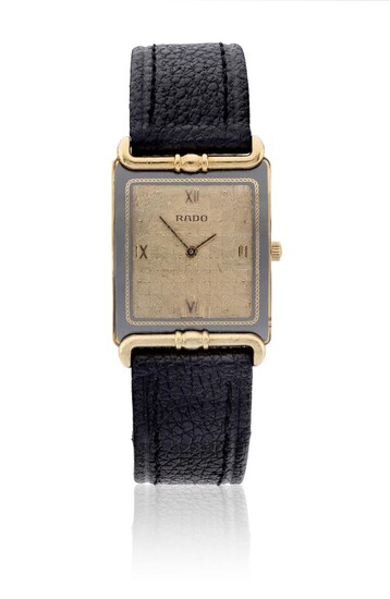 Rado. An 18ct gold quartz rectangular wristwatch Ref. 153.8120.6, Case Number 3059050, c. 1990 Quartz movement, textured champagne dial with applied Roman quarters, rectangular gold case, the back held by 4 screws, fixed integral decorative lugs...
