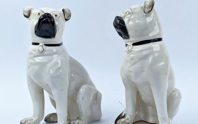 STAFFORDSHIRE PUG DOGS, an opposing pair, late 19th century,...