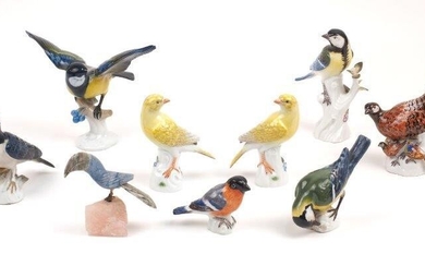 Seven Meissen porcelain birds, late 19th and 20th centuries, including a swallow perched on a tree trunk, incised no. H 91, 10cm high, a pheasant with her chicks, incised no. 195 K, 16cm high, a great tit perched on a tree trunk, incised no. 223...