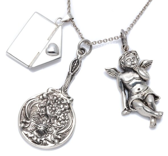 THREE VICTORIAN STYLE SILVER PENDANTS ON CHAIN; envelope, cherub, and a miniature hand mirror adorned with nouveau lady, 3.5-5.5cm l...