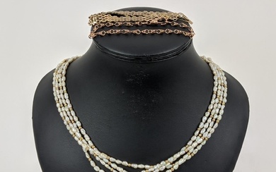 A FOUR STRAND RICE PEARL NECKLACE, with a gold ball clasp, a...