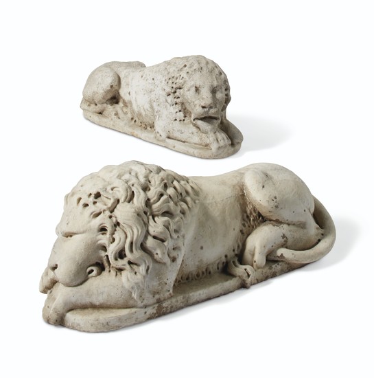 TWO CARVED MARBLE RECUMBENT LIONS, 20TH CENTURY