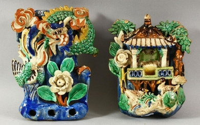 TWO CHINESE POLYCHROME POTTERY WALL POCKETS, carved