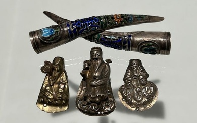 TWO CHINESE QING DYNASTY SILVER AND ENAMEL NAIL GUARDS AND THREE HAT FIGURINE ORNAMENTS