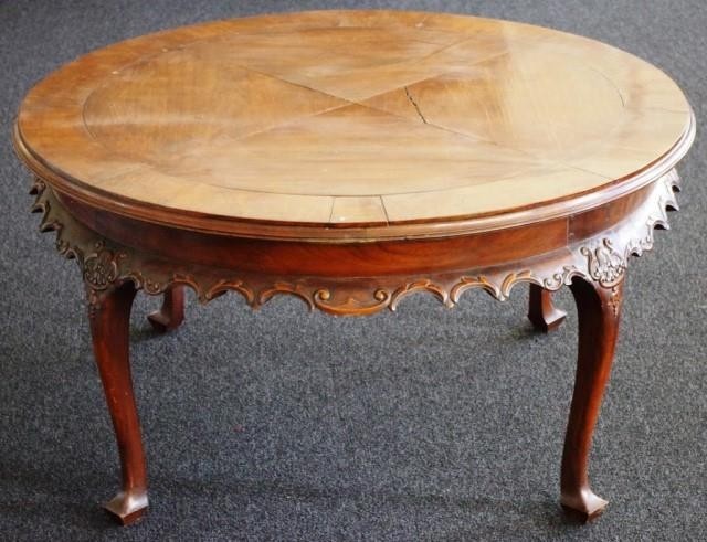 Vintage round hardwood coffee table with scroll carved flare...
