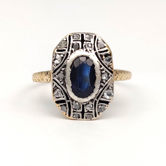 yellow gold ring with diamonds and sapphire