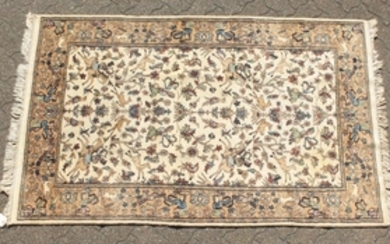 A GOOD INDIAN WOOL RUG with hunting scenes on a white