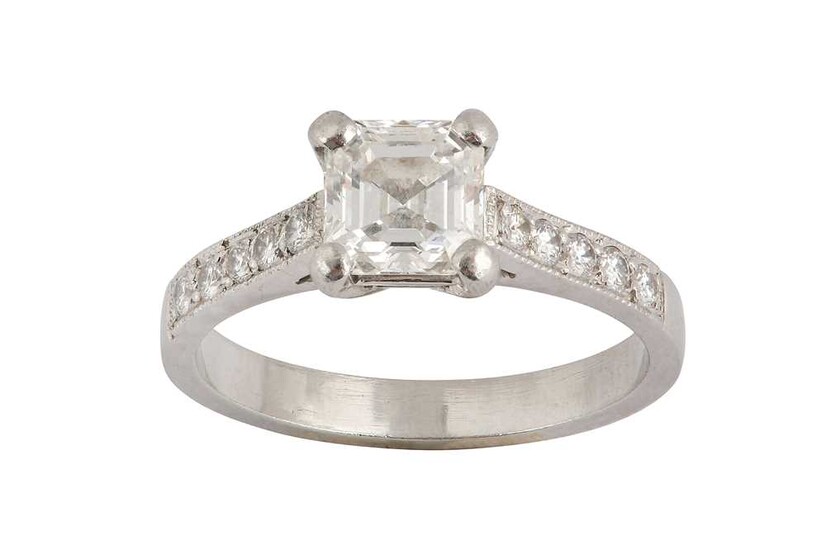 A diamond single-stone ring The cut-cornered square-cut diamond, weighing...
