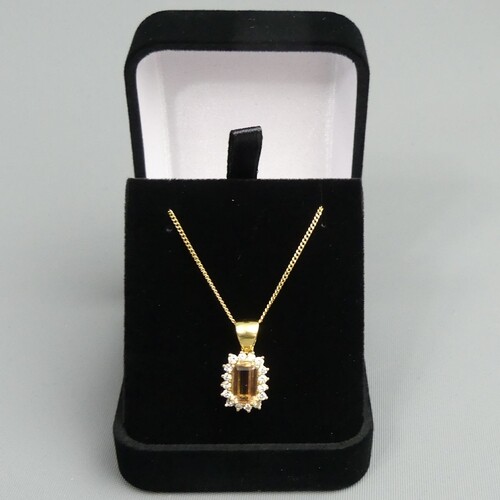 18 carat gold peach morganite and diamond pendant on a 52 cm...