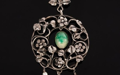 An Art Nouveau pendant of wreath form, set a central