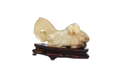 A CHINESE AGATE 'HORSE AND MONKEY' CARVING. Qing...