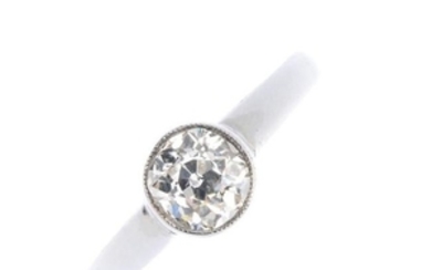 A diamond single-stone ring. The old-cut diamond
