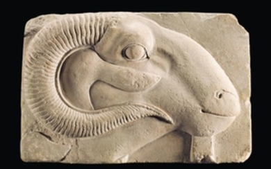 AN EGYPTIAN LIMESTONE RELIEF WITH THE HEAD OF A RAM, PTOLEMAIC PERIOD, 332-30 B.C.