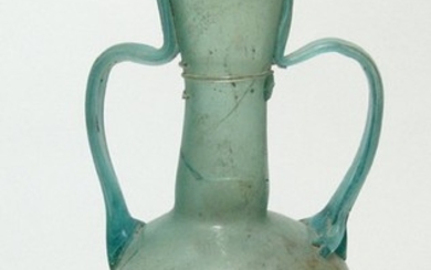 A large Roman glass two-handled bottle