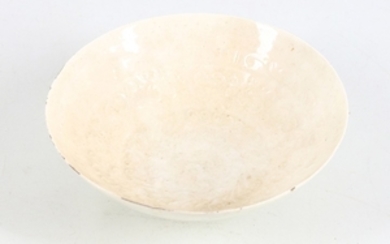 A Chinese white glazed moulded bowl, Song dynasty...