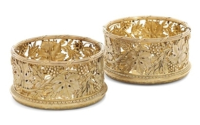 A PAIR OF GEORGE III SILVER-GILT WINE-COASTERS, MARK OF PAUL STORR, LONDON, 1817, RETAILED BY RUNDELL, BRIDGE AND RUNDELL