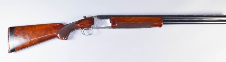 A 12 Bore Over and Under Shotgun, by Winchester,...
