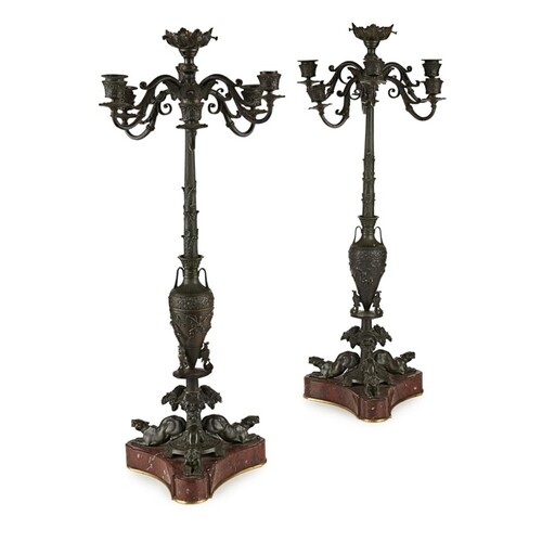 A 19TH CENTURY PAIR OF PATINATED BRONZE GRAND TOUR CANDELABR...