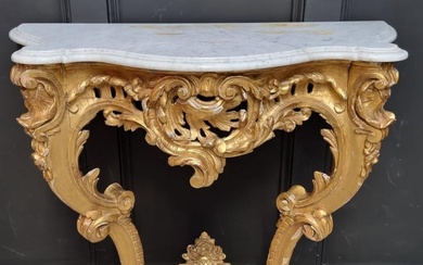 A 19th century, Louis XV style, carved giltwood and marble t...
