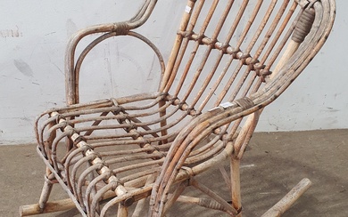 A CHILDS CANE ROCKING CHAIR