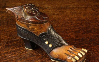 A Carved Treen Snuff Box in the form of a lady's foot wearing an open toed shoe with inset bone toen