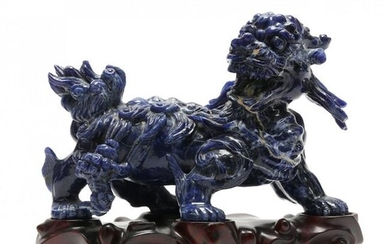 A Chinese Lapis Lazuli Mythical Lion Carving with Stand