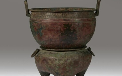 A Chinese archaic bronze steamer and associated stand