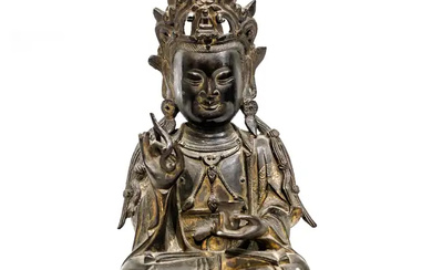 A Chinese bronze figure of Guanyin Ming dynasty The Bodhisattva seated in...
