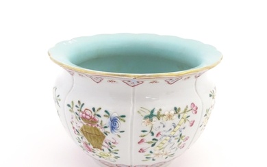A Chinese famille rose bowl with scalloped edge decorated wi...