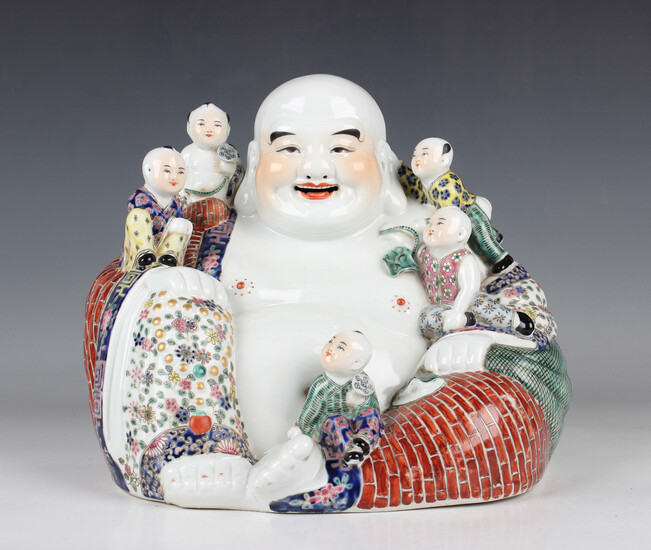 A Chinese famille rose porcelain Buddha, probably 20th century, modelled seated wearing a colourful
