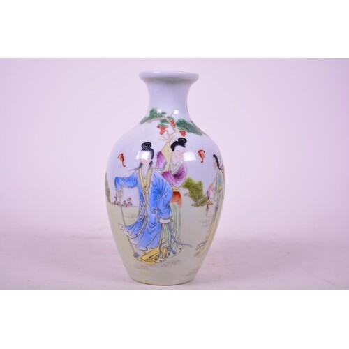 A Chinese porcelain vase decorated with ladies in a garden s...