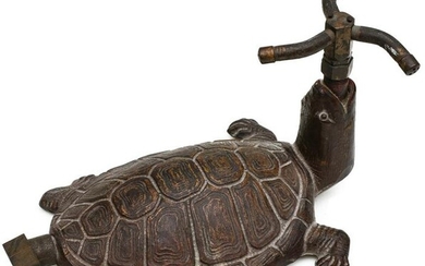 A DETAILED CAST IRON TURTLE FORM LAWN SPRINKLER