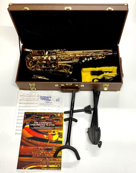 A Earlham professional series II saxophone with case and stand.