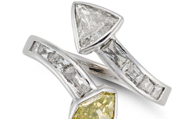 A FANCY INTENSE GREENISH YELLOW DIAMOND CROSSOVER RING set with a modified shield mixed cut fancy...