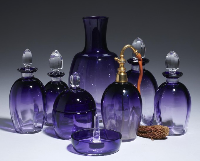A FRENCH AMETHYST GLASS DRESSING TABLE SET, C1930 including...
