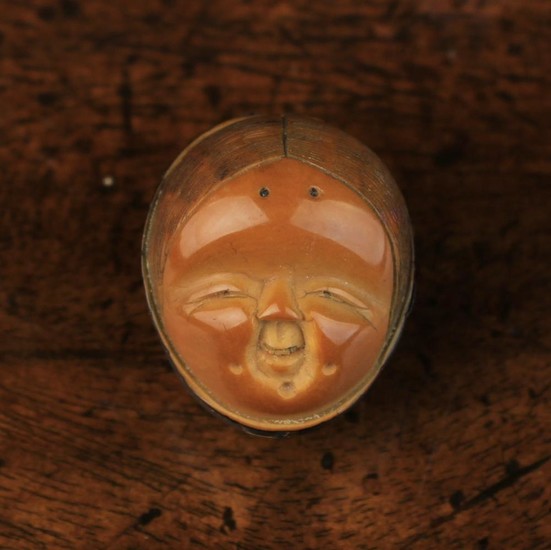 A Fine 19th Century Carved Corozo Nut Netsuke by Masaharu signed in a reserve to the back. Carved as