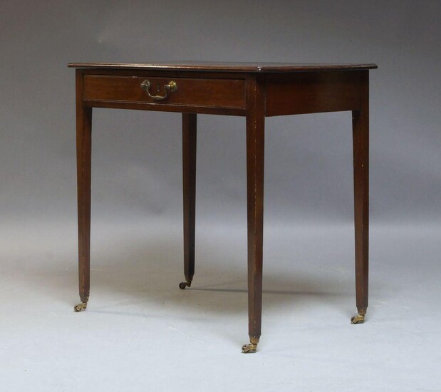 A George III mahogany Pembroke table, the oval top above frieze drawer with opposing faux drawer on square tapering legs with brass caps and castors, 71cm high, 107cm wide (open) 79cm deep, together with a George III mahogany side table, 73cm, 76cm...