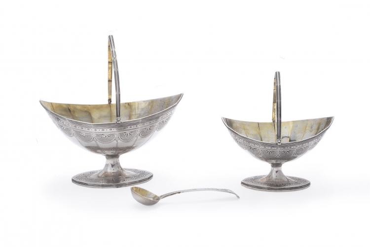 A George III silver navette pedestal cream basket, matching sugar basket and spoon by Charles Hougham