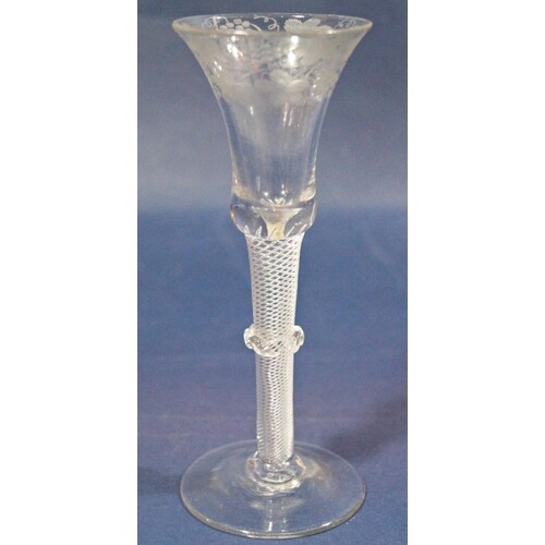A Georgian stemmed wine glass, the bell shaped bowl etched w...