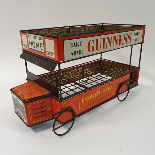 A Guinness bottle holder in the form of a truck