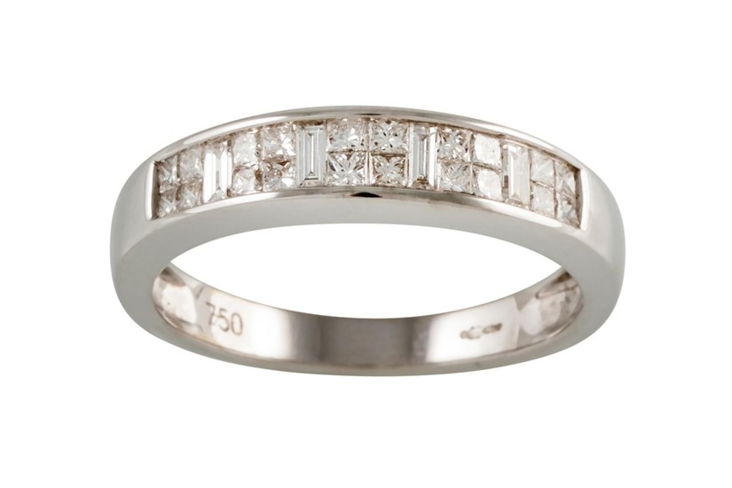 A HALF ETERNITY DIAMOND RING, with clusters of baguette and ...