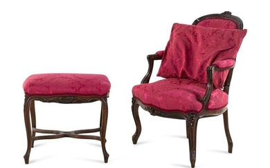 A Louis XV Style Carved Walnut Fauteuil and Tabouret
