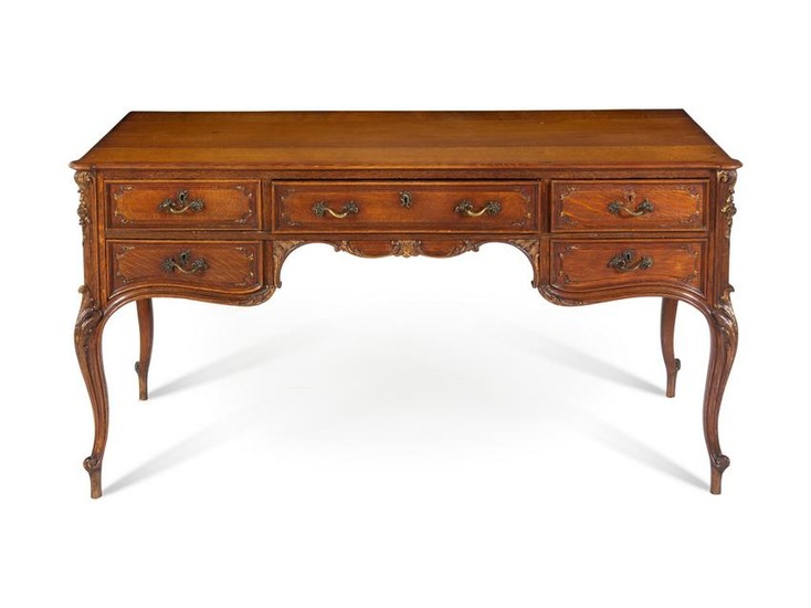 A Louis XV Style Parcel Gilt Oak Bureau Plat