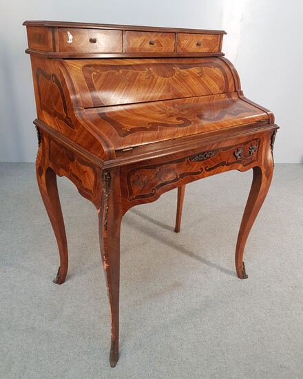 A Louis XV style cylinder chest of drawers with inlaid...