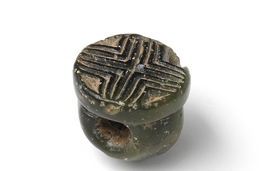 A Minoan dark green semi-translucent steatite seal ring