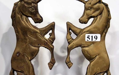 A PAIR OF BRASS UNICORN BOOKENDS