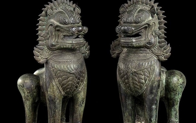 A PAIR OF BRONZE KHMER STYLE BUDDHIST LIONS Cambodia, 20th...